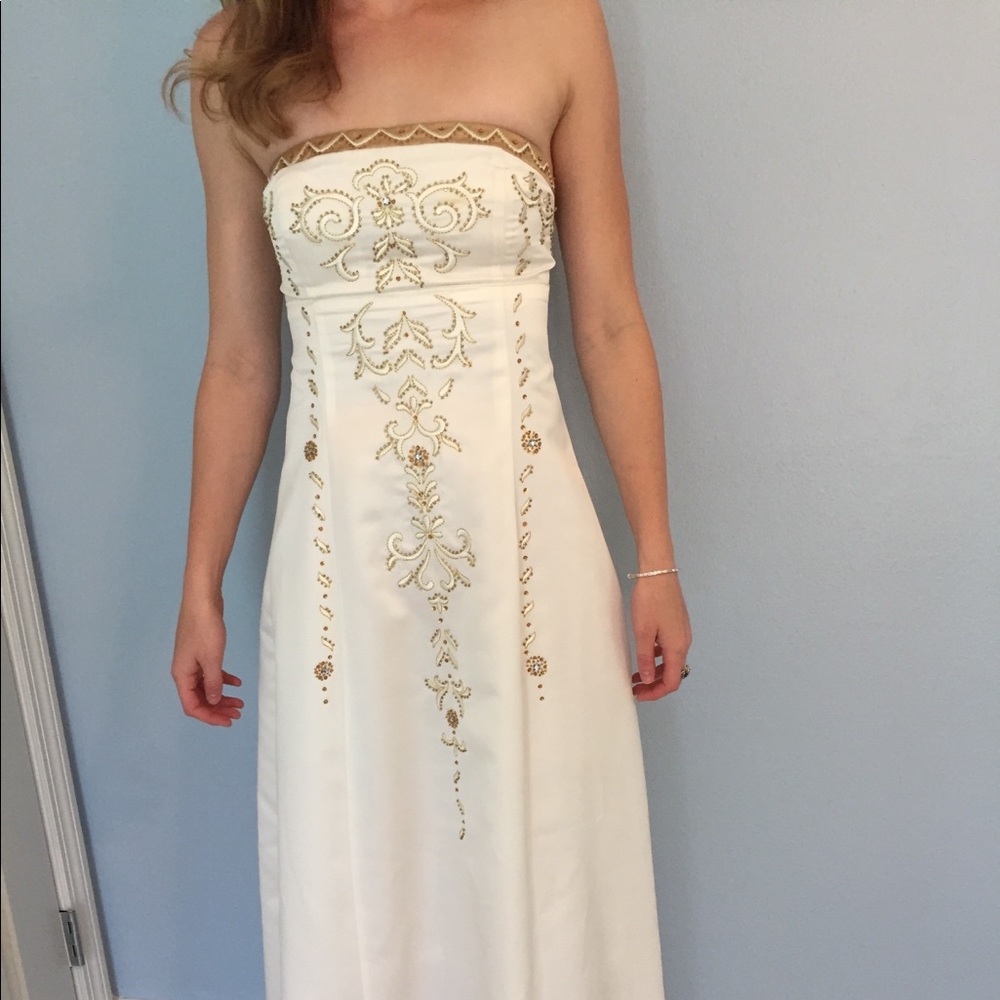 Timeless white gown with intricate gold detailing!